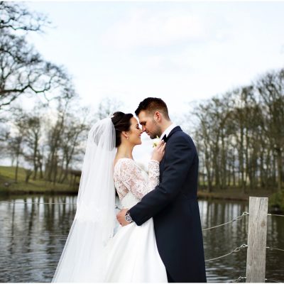 bride and groom by lake at Merrydale manor