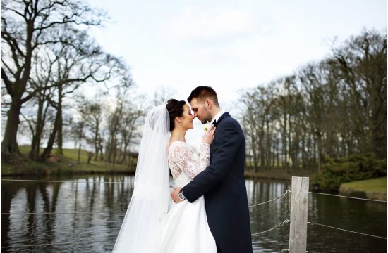 bride and groom by lake at Merrydale manor
